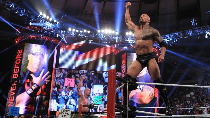 In this image released by WWE, actor and wrestler Dwayne "The Rock" Johnson competes in the 25th Anniversary of Survivor Series at Madison Square Garden, Sunday, Nov. 20, 2011 in New York. (AP Photo/WWE)