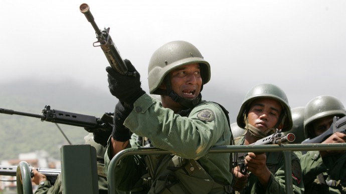 Venezuelan marines representing foreign invaders train on the outskirts of Caracas in La Guaira, Venezuela, Thursday, June 8, 2006. (AP Photo/Leslie Mazoch)