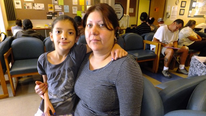 This photo taken July 16, 2012 shows Claudia Pedroza, 39, and her eight-year-old daughter Karla Osorio at the Jefferson Action Center in Lakewood, Colo. (AP Photo/Kristen Wyatt)