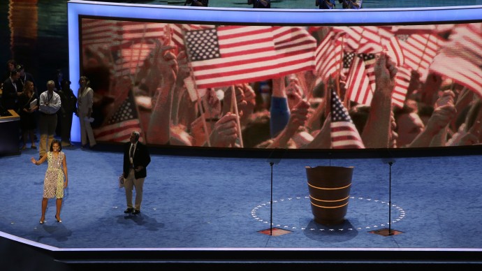 First Lady Michelle Obama waves to volunteers during a sound check for the Democratic National Convention in Charlotte, N.C., on Monday, Sept. 3, 2012. (AP Photo/Lynne Sladky)