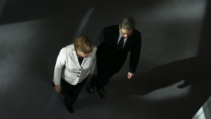 German Chancellor Angela Merkel arrives for the second day of the first session of the budget 2013 debate at the parliament Bundestag in Berlin, Wednesday, Sept. 12, 2012. (AP Photo/Markus Schreiber)