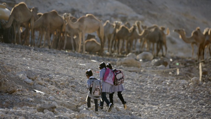 Palestinian Bedouin Students walk to their school at Khan al-Ahmar, near the west bank city of Jericho, Sunday, Sept 2. 2012. (AP Photo/Majdi Mohammed)