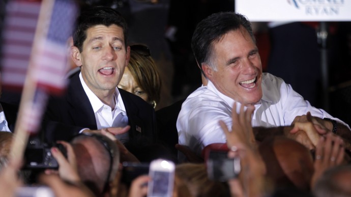 In this Aug. 11, 2012, file photo, Republican presidential candidate, former Massachusetts Gov. Mitt Romney, right, and vice presidential running mate, Rep. Paul Ryan, R-Wis., left, greet supporters, during a campaign rally in Manassas, Va. (AP Photo/Pablo Martinez Monsivais, File)