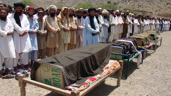 In this Thursday, June 16, 2011, file photo, Pakistani villagers offer funeral prayers for people who were reportedly killed by a U.S. drone attack in Miranshah, capital of Pakistani tribal region of North Waziristan along the Afghanistan border. (AP Photo/Hasbunullah, File)