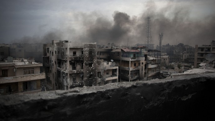 Smoke rises over Saif Al Dawla district in Aleppo, Syria, Tuesday, Oct. 2, 2012. (AP Photo/ Manu Brabo)