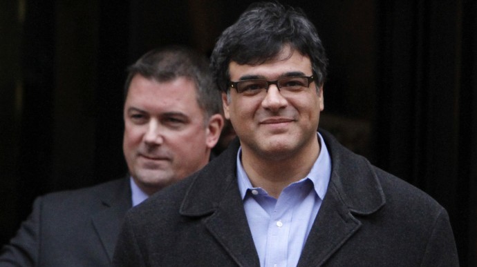 In this Jan. 23, 2012, file photo, former CIA officer John Kiriakou, right, accompanied by his attorney John Hundley, leaves Federal Court in Alexandria, Va. Kiriakou is accused of leaking the names of covert operatives to journalists is expected to enter a guilty plea as part of a plea deal Tuesday, Oct. 23, 2012,  in U.S. District Court in Alexandria, Va. (AP Photo/Jacquelyn Martin, File)