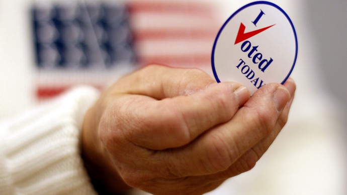This Nov. 2, 2010 file photo shows a sticker handed out to a voter on Election Day, in Waterville, Maine. (AP Photo/Robert F. Bukaty, File)