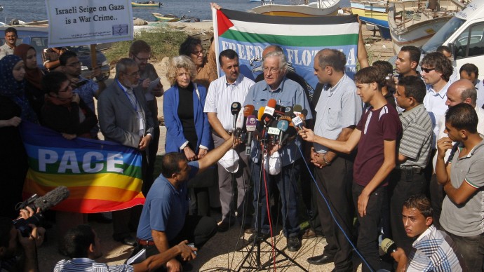Jewish-American scholar and activist Noam Chomsky, center, speaks during a press conference to support the Gaza-bound flotilla in the port of Gaza City, Saturday, Oct. 20, 2012. (AP Photo/Hatem Moussa)