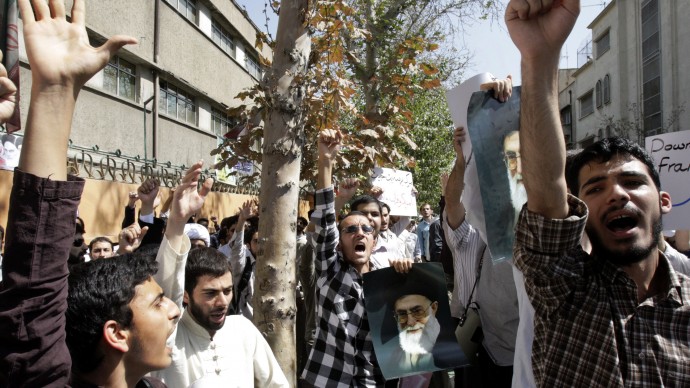 Holding posters of Iranian supreme leader Ayatollah Ali Khamenei, demonstrators chant slogans in front of the French Embassy in Tehran, Iran, Thursday, Sept. 20, 2012, during a protest the publication of caricatures of Islam's Prophet Muhammad by a French satirical weekly. (AP Photo/Vahid Salemi)