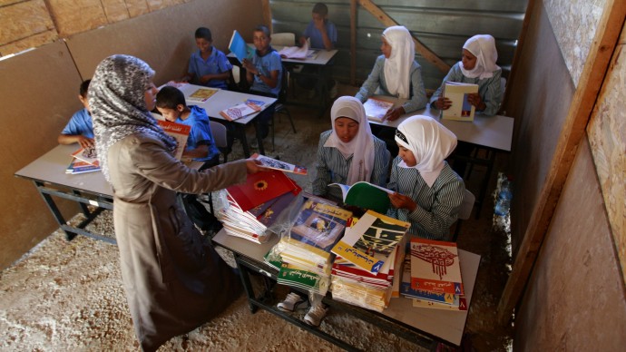 Palestinian Bedouin Students attend class at their school at Khan al-Ahmar, near the west bank city of Jericho, Sunday, Sept 2. 2012. (AP Photo/Majdi Mohammed)