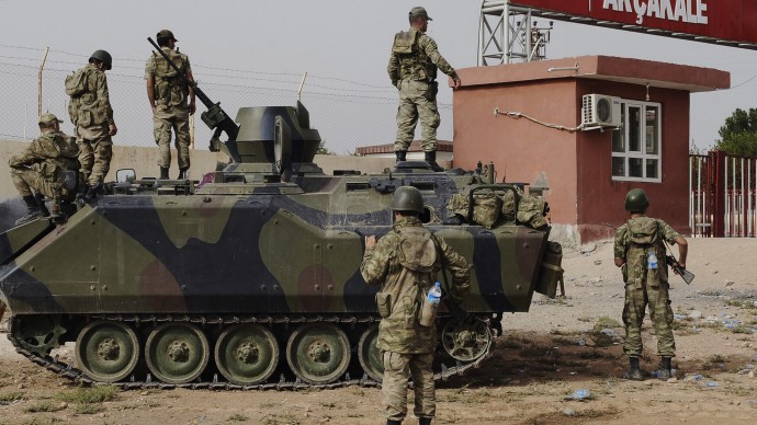 In this Sunday, Oct. 7, 2012 file photo, Turkish military station at the border gate with Syria, across from Syrian rebel-controlled Tel Abyad town, in Akcakale, Turkey. (AP Photo, File)