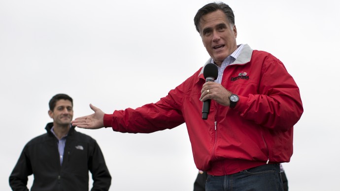 Republican presidential candidate, former Massachusetts Gov. Mitt Romney, right, speaks as vice presidential running mate Rep. Paul Ryan, R-Wis., looks on during a campaign rally on Tuesday, Sept. 25, 2012 in Vandalia, Ohio.  (AP Photo/ Evan Vucci)