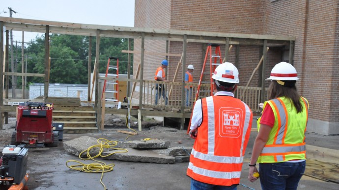Construction workers walk through a construction area on June 20, 2011. (Photo by the US Army Corps of Engineers via Flikr)