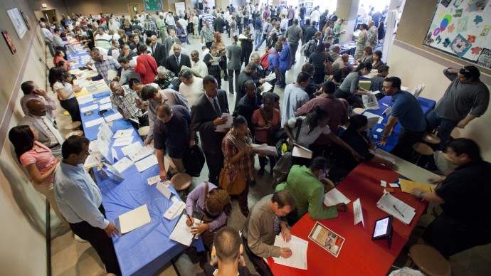 Job seekers gather for employment opportunities at the 11th annual Skid Row Career Fair at the Los Angeles Mission on Thursday, May 31, 2012 in Los Angeles. (AP Photo/Damian Dovarganes)