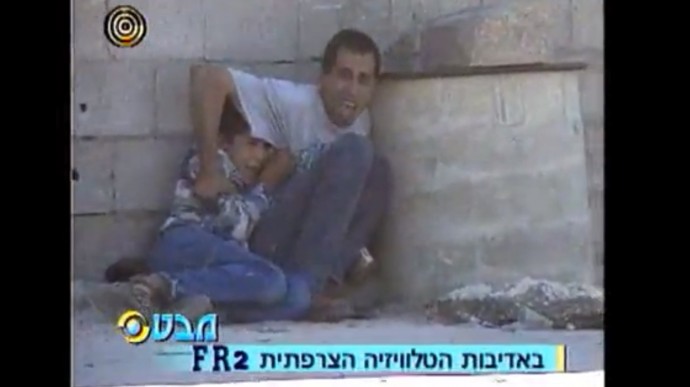 Screen shot from the 60-seconds of raw footage of Jamal and Muhammad al-Durrah on Sept. 30, 2000. (Video filmed by Talal abu Rahmah)