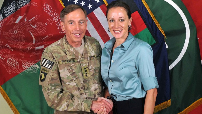 This July 13, 2011, photo made available on the International Security Assistance Force's Flickr website shows the former Commander of International Security Assistance Force and U.S. Forces-Afghanistan Gen. Davis Petraeus, left, shaking hands with Paula Broadwell, co-author of  "All In: The Education of General David Petraeus." (AP Photo/ISAF)