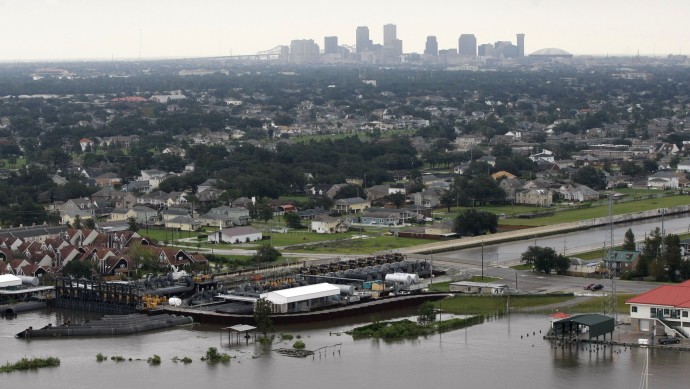 This Aug. 30, 2012 file photo shows the pumping station at the 17th Street Canal, built after Hurricane Katrina breached the canal and flooded New Orleans, with the intact canal wall after Hurricane Isaac came through the region. (AP Photo/Gerald Herbert, file)