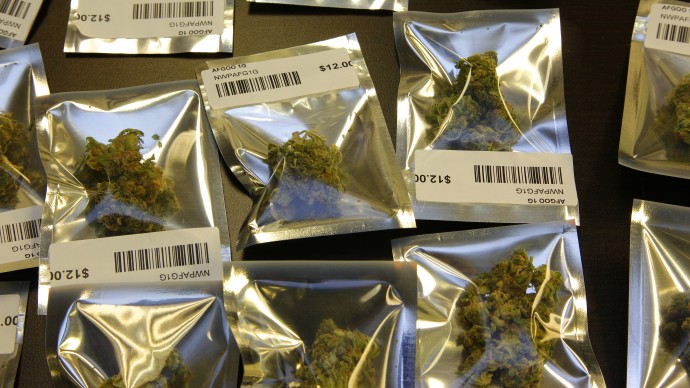 In this Wednesday, Nov. 7, 2012 file photo, medical marijuana is packaged for sale in 1-gram packages at the Northwest Patient Resource Center medical marijuana dispensary, in Seattle. (AP Photo/Ted S. Warren, File)