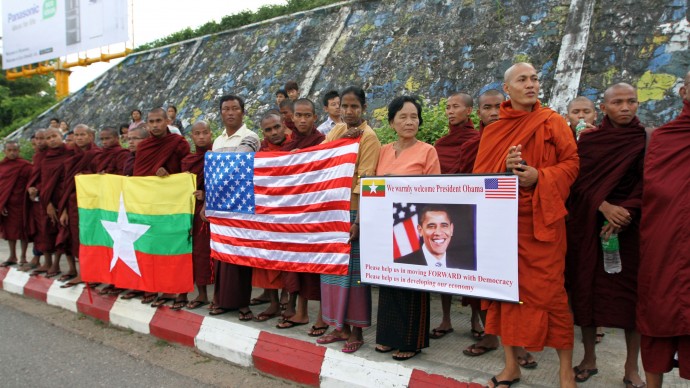 Myanmar Buddhist monks wait to welcome the arrival of U.S. President Barack Obama at Yangon International airport Monday, Nov. 19, 2012, in Yangon, Myanmar. (AP Photo/Khin Maung Win)