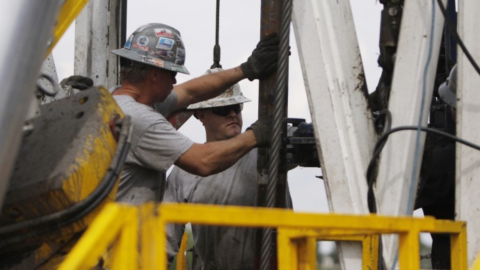 In this Tuesday, Aug. 25, 2009 file photo, crew members with Anadarko Petroleum Corp., work on a drilling platform on a Weld County farm near Mead, Colo., in the northeastern part of the state. (AP Photo/Ed Andrieski, File)