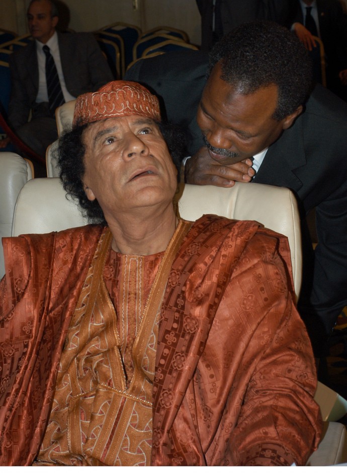 SHARM EL SHEIKH, EGYPT - MARCH 1: Libyan Leader, Moammar Gadhafi listens to one of his advisers during a sort break at the Arab summit. (Photo by Norbert Schiller/Getty Images)