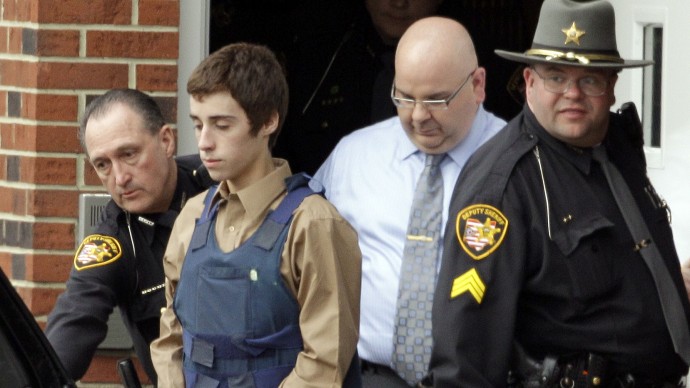 In this Tuesday, Feb. 28, 2012 photo, seventeen-year-old T.J. Lane is led from Juvenile Court by Sheriff's deputies in Chardon, Ohio, after his arraignment in the shooting of five high school students Monday. (AP Photo/Mark Duncan)