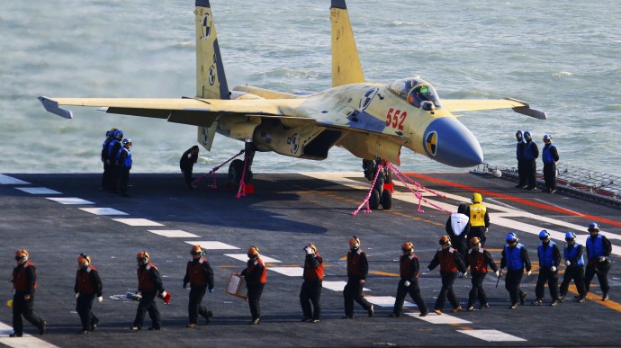 This undated photo shows a carrier-borne J-15 fighter jet on China's first aircraft carrier, the Liaoning. (Xinhua/Zha Chunming)