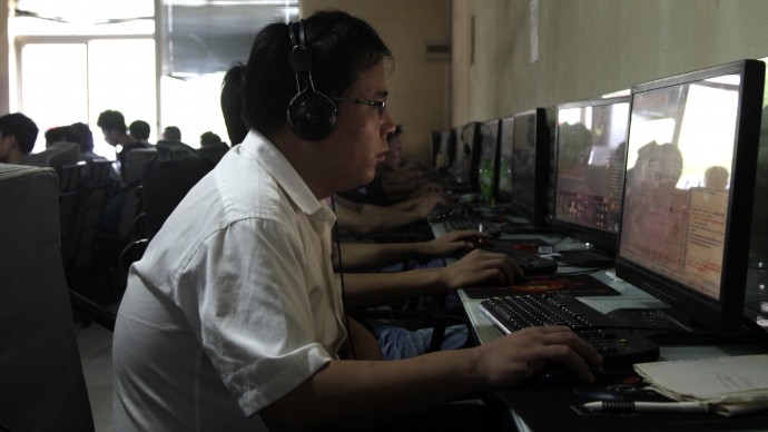 In this photo taken Wednesday, July 14, 2010, a Chinese man uses a computer at an internet cafe in Beijing, China. (AP Photo/Ng Han Guan)