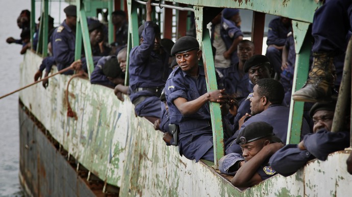 Police Nationale du Congo officers who fled Goma when M23 rebels took over the city Nov. 18 2012, return on a barge to the port of Goma, eastern Congo, Friday Nov. 30, 2012. (AP Photo/Jerome Delay)