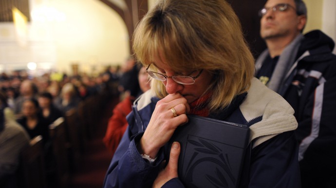 Mourners gather at a vigil service for victims of the Sandy Hook Elementary School shooting, at the St. Rose of Lima Roman Catholic Church in Newtown, Conn. Friday, Dec. 14, 2012. (AP Photo/Andrew Gombert, Pool)