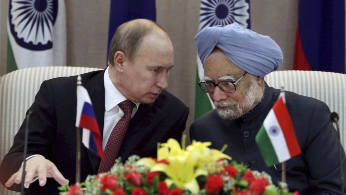 Russian President Vladimir Putin, left, talks to Indian Prime Minister Manmohan Singh as they jointly address the media after a meeting in New Delhi, India, Monday, Dec. 24, 2012. (AP Photo/PTI, Pool)