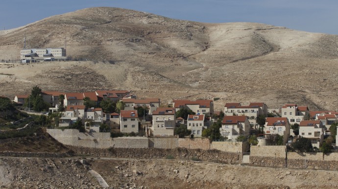 A view of the Jewish West Bank settlement of Maaleh Adumim, with E1, background, near Jerusalem, Sunday, Dec. 2, 2012. (AP Photo/Ariel Schalit)