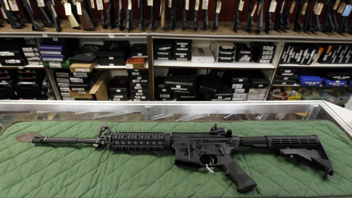 In this Thursday, July 26, 2012 file photo an AR-15 style rifle is displayed at the Firing-Line indoor range and gun shop, in Aurora, Colo. (AP Photo/Alex Brandon, File)