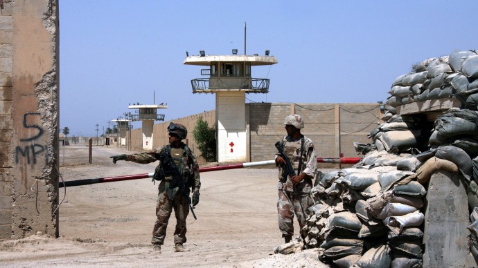 In this Sept. 2, 2006, file photo, Iraqi army soldiers stand guard at the Abu Ghraib prison, after taking over from U.S. soldiers, on the outskirts of Baghdad, Iraq. (AP Photo/Khalid Mohammed, File)