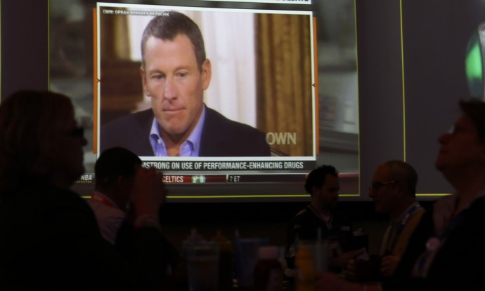 A video screen at a hotel restaurant in Grapevine, Texas, Friday, Jan. 18, 2013, shows a replay telecast of a segment of Lance Armstrong being interviewed by Oprah Winfrey. (AP Photo/LM Otero)