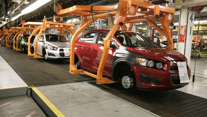 In this April 25, 2012 photo, Chevrolet Sonics move down the line at the General Motors Orion Assembly plant in Orion Township, Mich. (AP Photo/Duane Burleson)