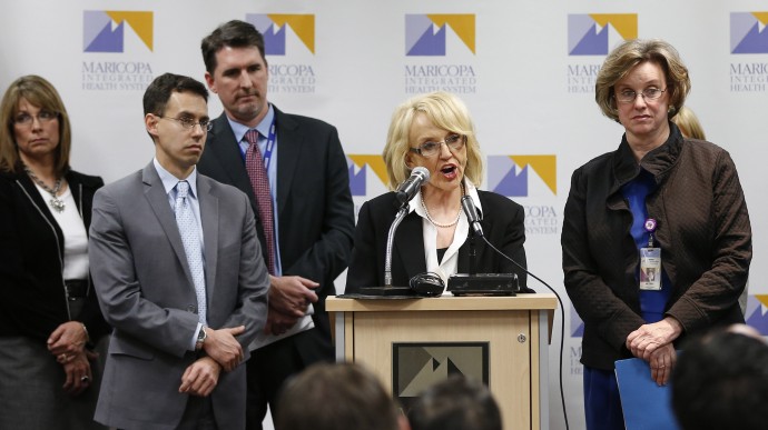 Arizona Gov. Jan Brewer, center,  calls for the expansion of Medicaid, Wednesday, Jan. 26, 2013 in Phoenix with healthcare and business leaders at Maricopa Medical Center. (AP Photo/Matt York)