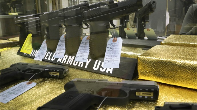 Hand guns are seen for sale at Capitol City Arms Supply Wednesday, Jan. 16, 2013 in Springfield, Ill. AP Photo/Seth Perlman)