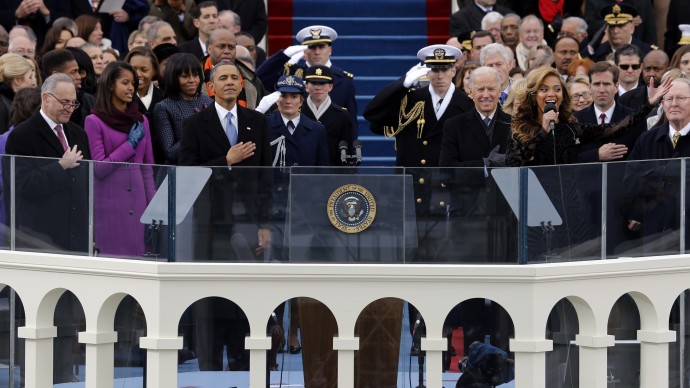 President Barack Obama, left and Vice President Joe Biden listen as singer Beyonce sings the National Anthem at the ceremonial swearing-in on the West Front of the U.S. Capitol during the 57th Presidential Inauguration in Washington, Monday, Jan. 21, 2013. (AP Photo/Scott Andrews, Pool)
