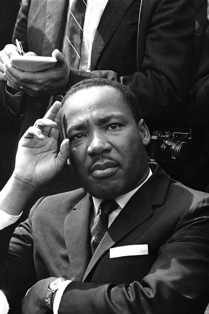 In this Sept. 16, 1963 file photo, Dr. Martin Luther King Jr. gives a news conference in Birmingham, Ala. announcing he and other African American leaders have called for federal Army occupation of Birmingham in the wake of the previous day's church bombing and shootings which left six blacks dead. (AP Photo)