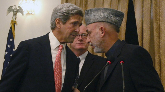 In this Oct. 20, 2009 file photo, Afghan President Hamid Karzai, right, whispers with the U.S. Sen. John Kerry, D-Mass, left, as Kai Eide head of the United Nations Assistance Mission in Afghanistan is seen, center, during a press conference, in Kabul, Afghanistan on Tuesday, Oct. 20, 2009.  Kerry, President Barack Obama’s  secretary of state, is a familiar face to the world leaders vital to American interests. (AP Photo/Musadeq Sadeq)