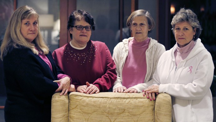 The Melnick sisters, who are suing Eli Lilly and Co. alleging that a synthetic estrogen known as DES caused them all to get breast cancer, pose at their hotel in Boston, Monday evening, Jan. 7, 2013. (AP Photo/Charles Krupa)