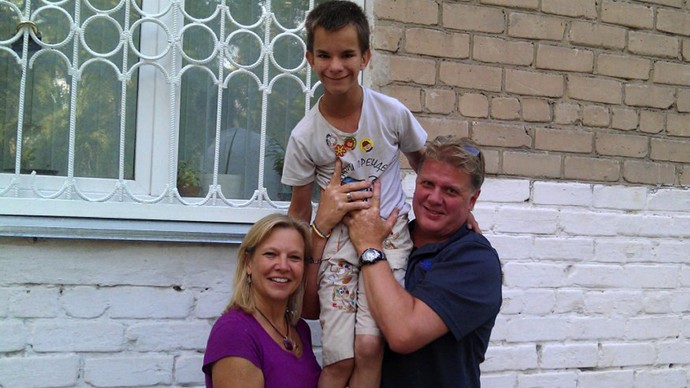 In this family photo taken in the summer of 2011 and approval by Dianna Wallen shows: from the left: Dianna Wallen, Maxim Kargapoltsev, Mill Wallen pose for a photo in Chelyabinsk, an industrial city about 1,500 kilometers (900 miles) east of Moscow, Russia. (AP Photo/HO, Dianna Wallen family handout)