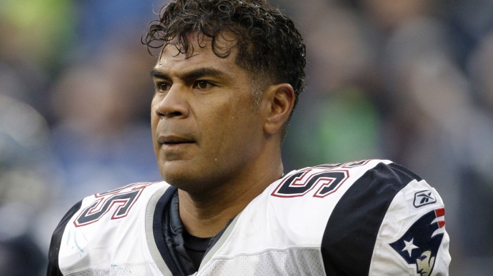 In this Dec. 7, 2008, file photo, New England Patriots' Junior Seau watches during an NFL football game against the Seattle Seahawks in Seattle. (AP Photo/Elaine Thompson, File)