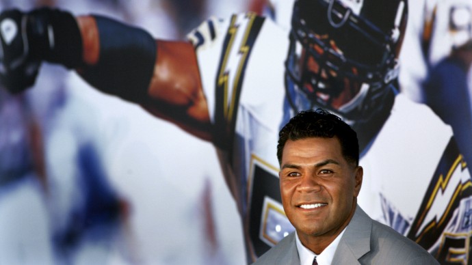 In this Aug. 14, 2006, file photo, former San Diego Chargers football player Junior Seau smiles during a news conference announcing his retirement from pro football in San Diego. (AP Photo/Sandy Huffaker, File)