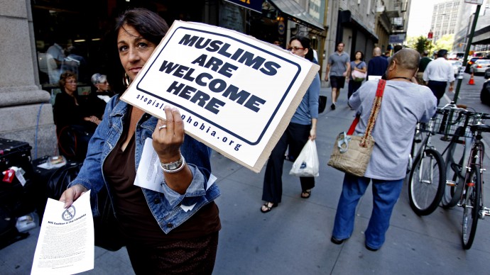 Elaine Brower of New York, with NYC Coalition to Stop Islamophobia, walks near the proposed mosque and Islamic community center near ground zero in New York, Friday, Sept. 10, 2010. (AP Photo/Craig Ruttle)