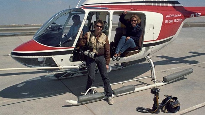 My colleague and I taking an "unsuspecting" lady on a chopper ride. We removed all the doors on the helicopter so that two still photographers and a videographer could shoot unimpeded. (Photo Norbert Schiller)