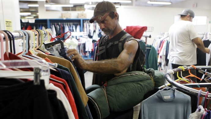 George Lamb, a homeless man, looks for used clothes at  Sacred Heart Community Center in San Jose, Calif., Thursday, Sept. 16, 2010. (AP Photo/Marcio Jose Sanchez)